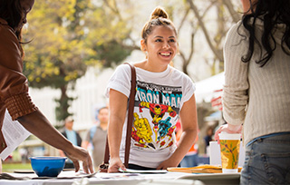 student helping at fair